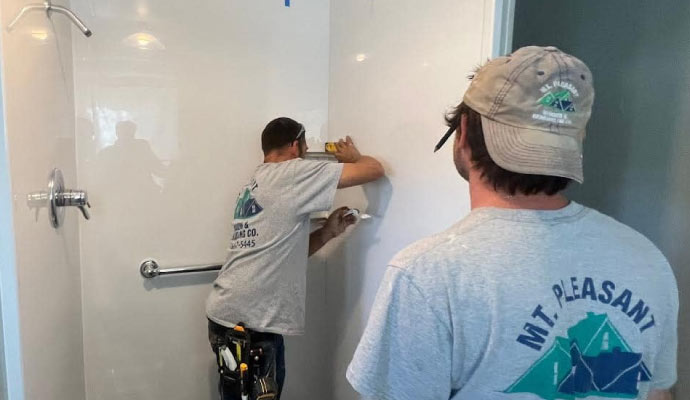 Person remodeling a bathroom